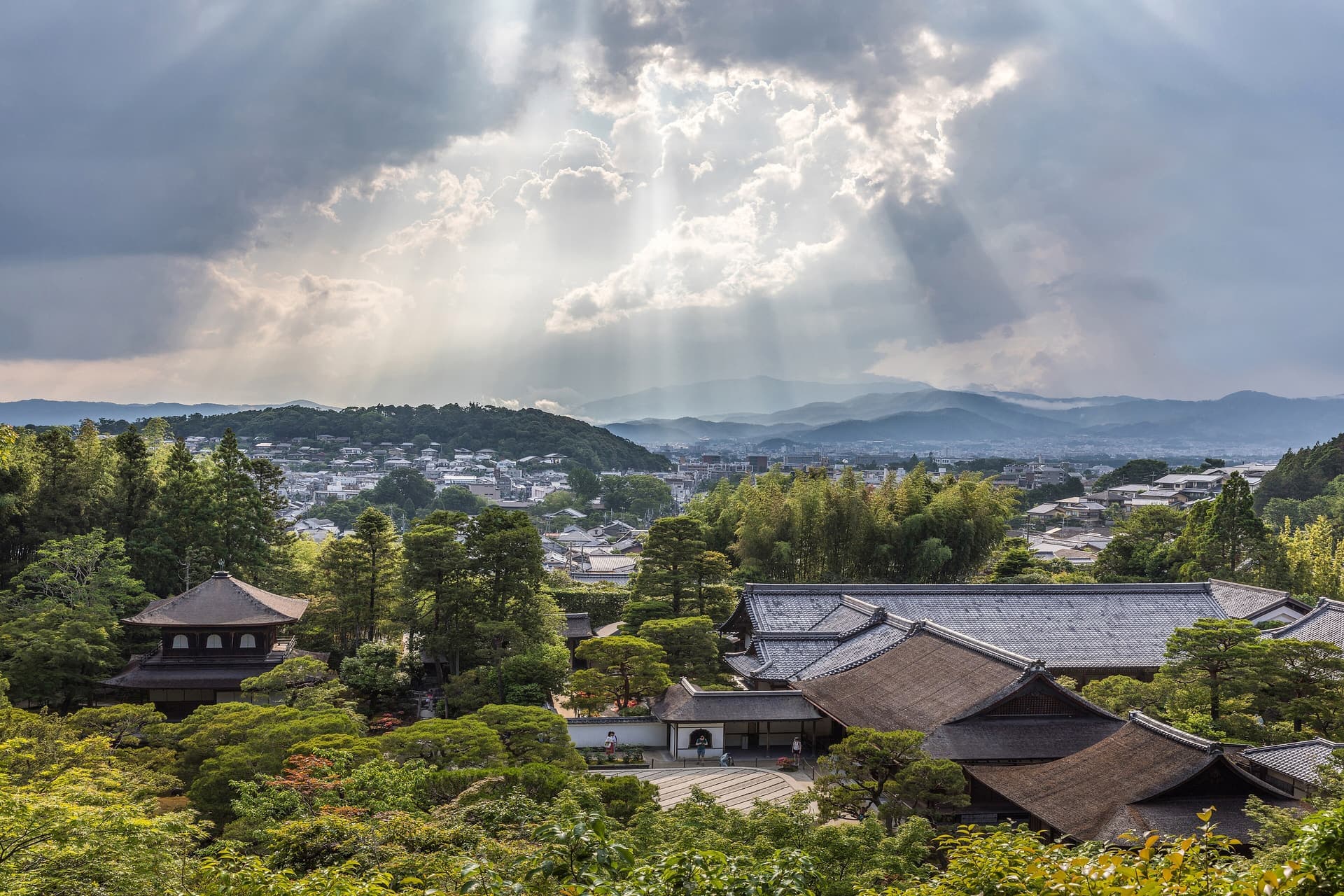 Ginkaku-ji temple and its gardens seen from above, with sunlight breaking through cloud, Kyoto