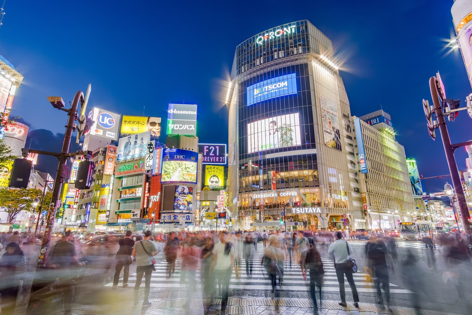 Pedestrians crossing the Shibuya scramble intersection in Tokyo