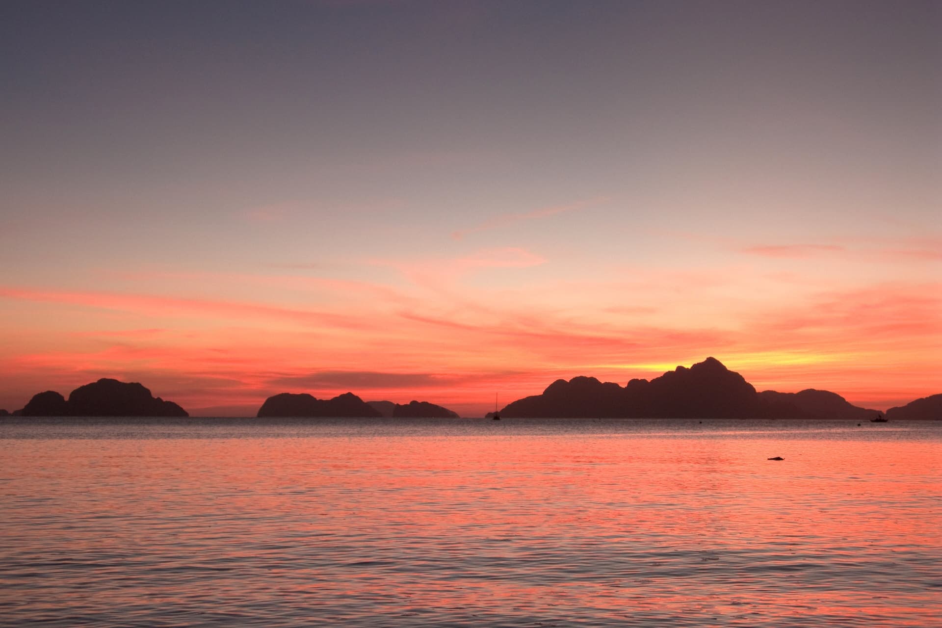 El Nido at twilight, with islands in silhouette across the bay
